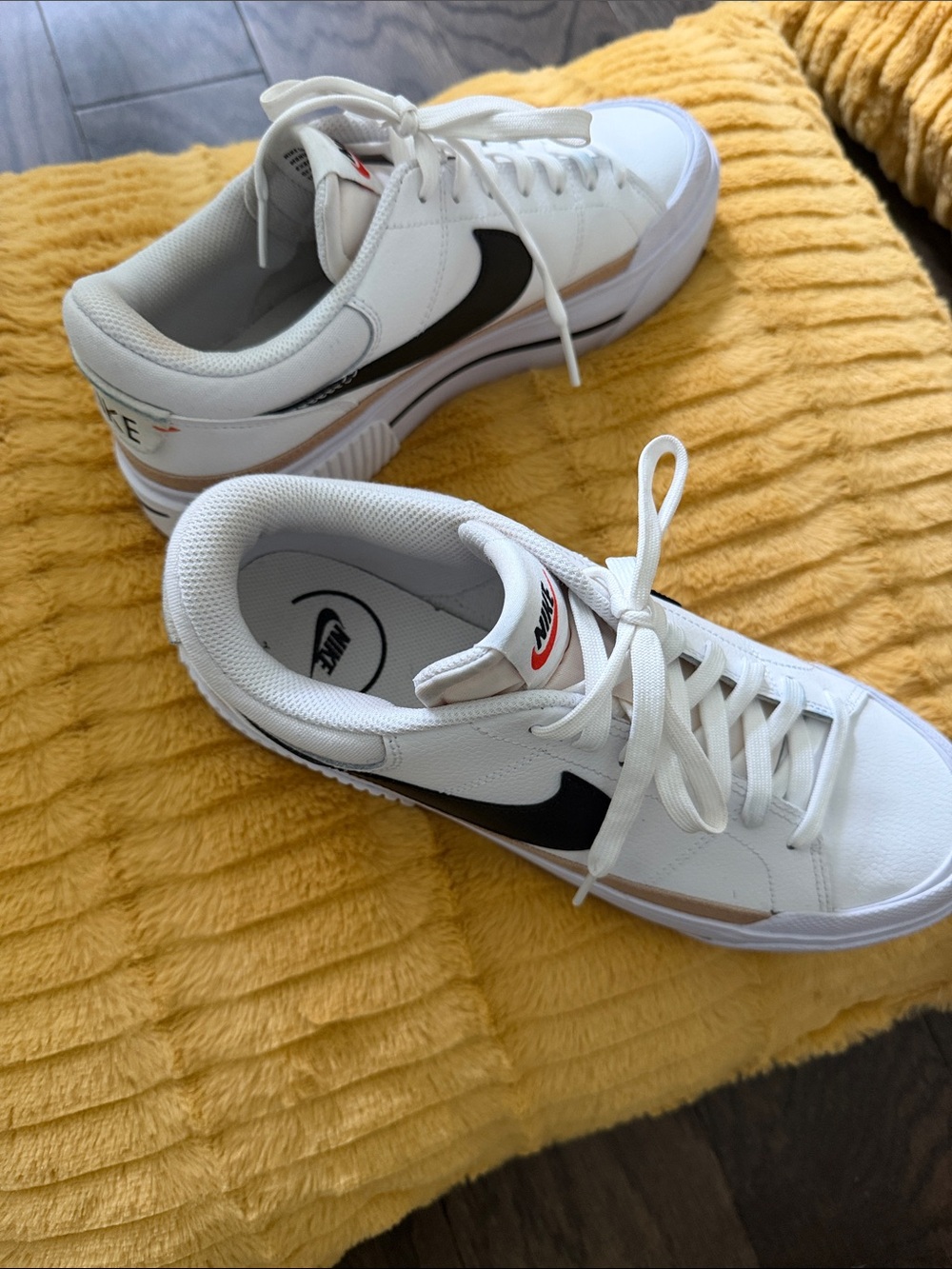 Nike Men’s White Leather Sneakers with Black Swoosh and Tan Accent